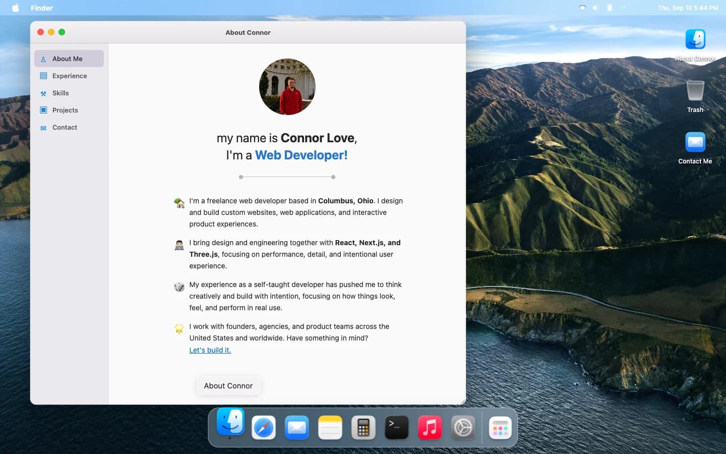 The desktop with the About Connor window open, a dock of apps, and a mountain wallpaper.